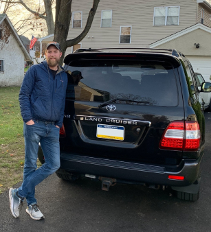 Photo of me standing next to my Land Cruiser